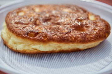 One large pancake on a white plate.