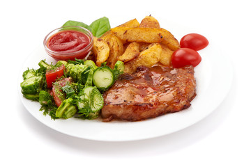 Baked juicy pork steak with fried potatoes, isolated on white background