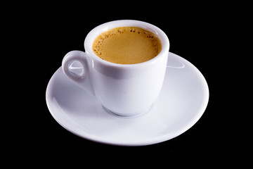 Espresso black coffee - made in a coffee machine with thick crema, of uniform golden-peanut color.