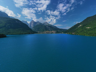 Aerial photography. Panoramic view of the lake Molveno north of Italy. Trento region. Great trip to the lake in the Alps.