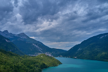 Naklejka na ściany i meble Aerial photography. Panoramic view of the lake Molveno north of Italy. Trento region. Great trip to the lake in the Alps.