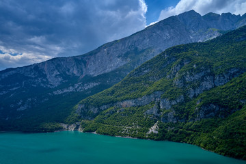 Naklejka na ściany i meble Aerial photography. Panoramic view of the lake Molveno north of Italy. Trento region. Great trip to the lake in the Alps.