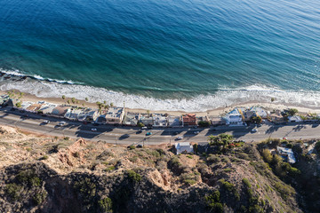 Aerial of Pacific Coast Highway homes and beaches north of Los Angeles and Santa Monica in scenic...