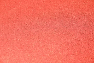Zelfklevend Fotobehang Red rubber running track background, top view © Atlas