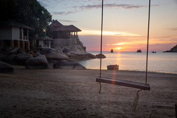 The view of sunset and swing