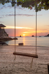 The view of sunset and swing