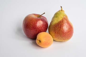pears and apple on white background