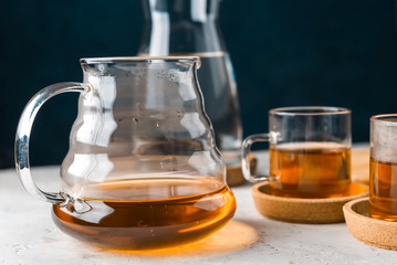 Alternative coffee brewing method,pure over,glass teapot on wooden tray with freshly brewed coffee