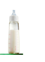 Baby bottle with milk on white background