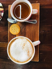 Close-up of coffee cup and tea cup on a table in cafe