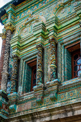 Fototapeta na wymiar Faced on the outer facade with majolica tiles Teremok was built in the late 17th century by architect Larion Kovalev, tiles and carved columns made Osip Elders with their sons.