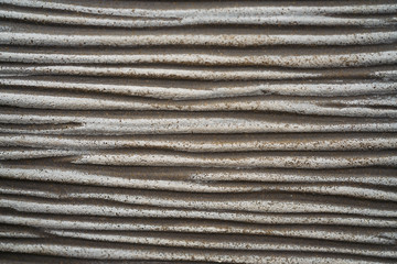 Background image of gray fibre glass reinforced plastic wall looking like cement texture or concrete with scratched structure made of durable, weather-proof and lightweight resin or epoxy for outdoor