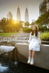 Young beautiful Asain Woman is enjoy traveling in Kuala Lumpur, Malaysia. - obrazy, fototapety, plakaty