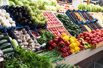 Vegetable farmer market counter: colorful various fresh organic healthy vegetables at grocery store. Healthy natural food concept