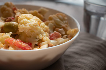 Healthy mediterranean cauliflower salad with tomato