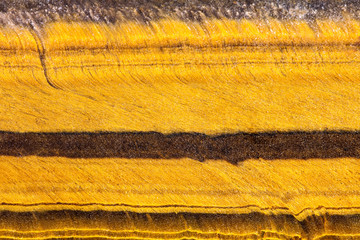 Hintergrund Schichten vom Tigerauge oder Tigerit, Makro Nahaufnahme Mineralien und Heilsteine