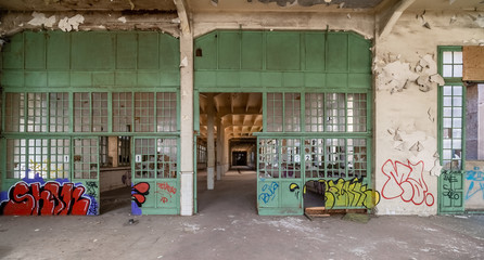 Old abandoned factory with graffiti - obrazy, fototapety, plakaty