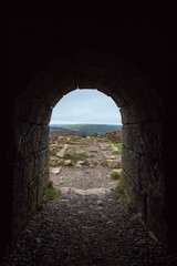View of Irish Countryside from a Dark Tunnel