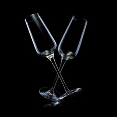 Set of empty luxury champagne glasse isolated on a black background
