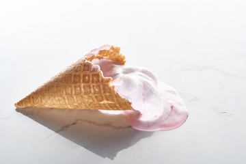 Obraz na płótnie Canvas delicious ice cream in waffle cone on marble grey background