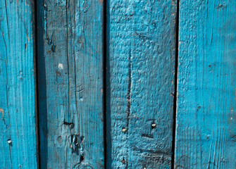 Old painted fence, shabby paint, background and texture blue