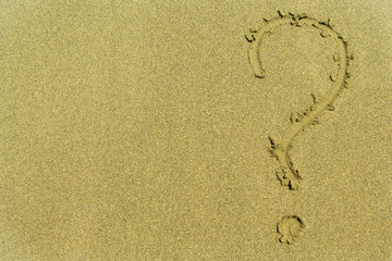 Question mark on the sand