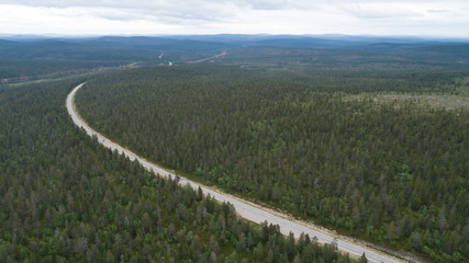 Natural landscape with highway through the woodland in europe. 