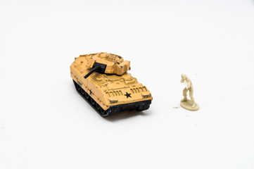 Miniature toy soldier with tank	