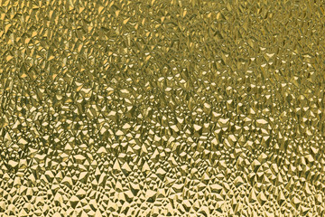 Yellow ribbed glass surface. Abstract background. Design element.