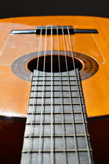 Fototapeta premium The strings and the fretboard of a spanish acoustic guitar 