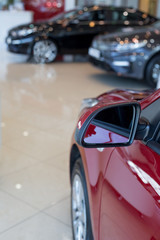 Car auto dealership. New cars at dealer showroom. Prestigious vehicles.