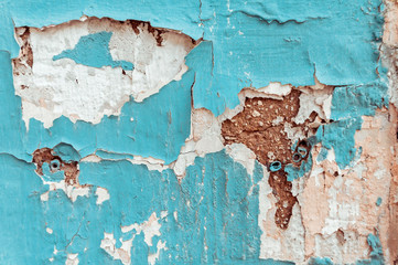 Texture of cracked blue and brown wall background.