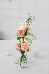 Fresh Flowers in Vase on Table, Wedding Floral Arrangment at Reception, Roses and Peonies in Glass Jars, White Background, Modern Barn Wedding