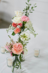Fresh Flowers in Vase on Table, Wedding Floral Arrangment at Reception, Roses and Peonies in Glass Jars, White Background, Modern Barn Wedding