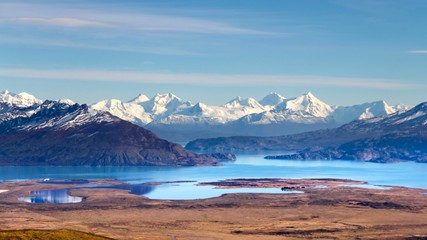 Scenic panoramic view to beautiful valley with turquoise lakes with snow-capped mountains on background in Los Glaciares national park,Patagonia,Argentina