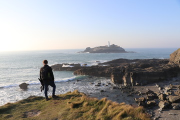 lone figure on cliffs