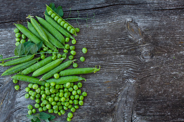 fresh pea on dark wooden surface