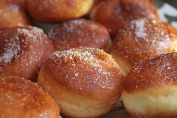 donuts with powdered sugar on plate