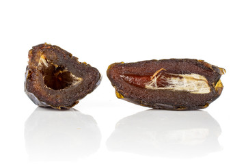 Group of two halves of dried brown date medjool section isolated on white background