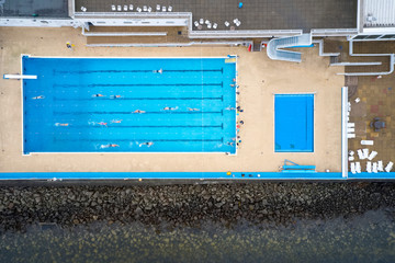 Gourock outdoor open air swimming pool starts lessons for senior elderly and disabled swimmers aerial view from above