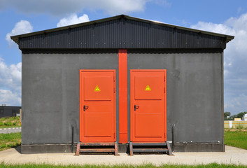 Iron red door of a transformer box.