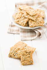 Salted crispy crackers with sesame and sunflower seeds
