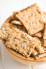 Salted crispy crackers with sesame and sunflower seeds