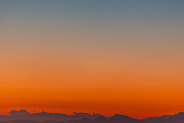 Beautiful profile of Aegean Sea islands at sunset with colorful sky