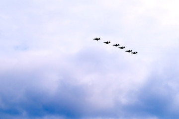 Combat system of modern fighters in the sky. Performing aerobatics Russian aircraft on parade.