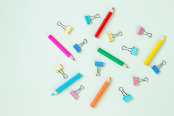 School equipment. Variety of school supplies. Flat lay.Flat lay photo of pastel background with colorful pencil and paper clip,copy space top view. concept of preparation for school. Pattern.