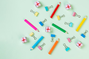 School equipment. Variety of school supplies. Flat lay.Flat lay photo of pastel background with colorful pencil and paper clip,copy space top view. concept of preparation for school. Pattern.