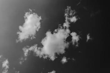 gray clouds on a dark and gloomy sky, monochrome