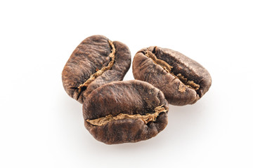 Coffee grains isolated on white background. Top view at an angle. For design.