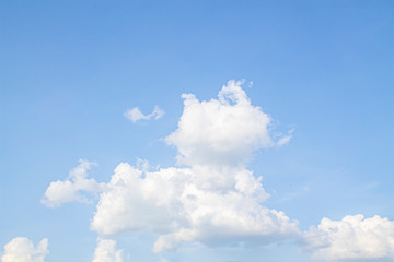 Naklejka na ściany i meble white clouds against the blue sky.